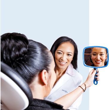 Dr. Charmaine Johnson with a Patient Reviewing their Dental Results